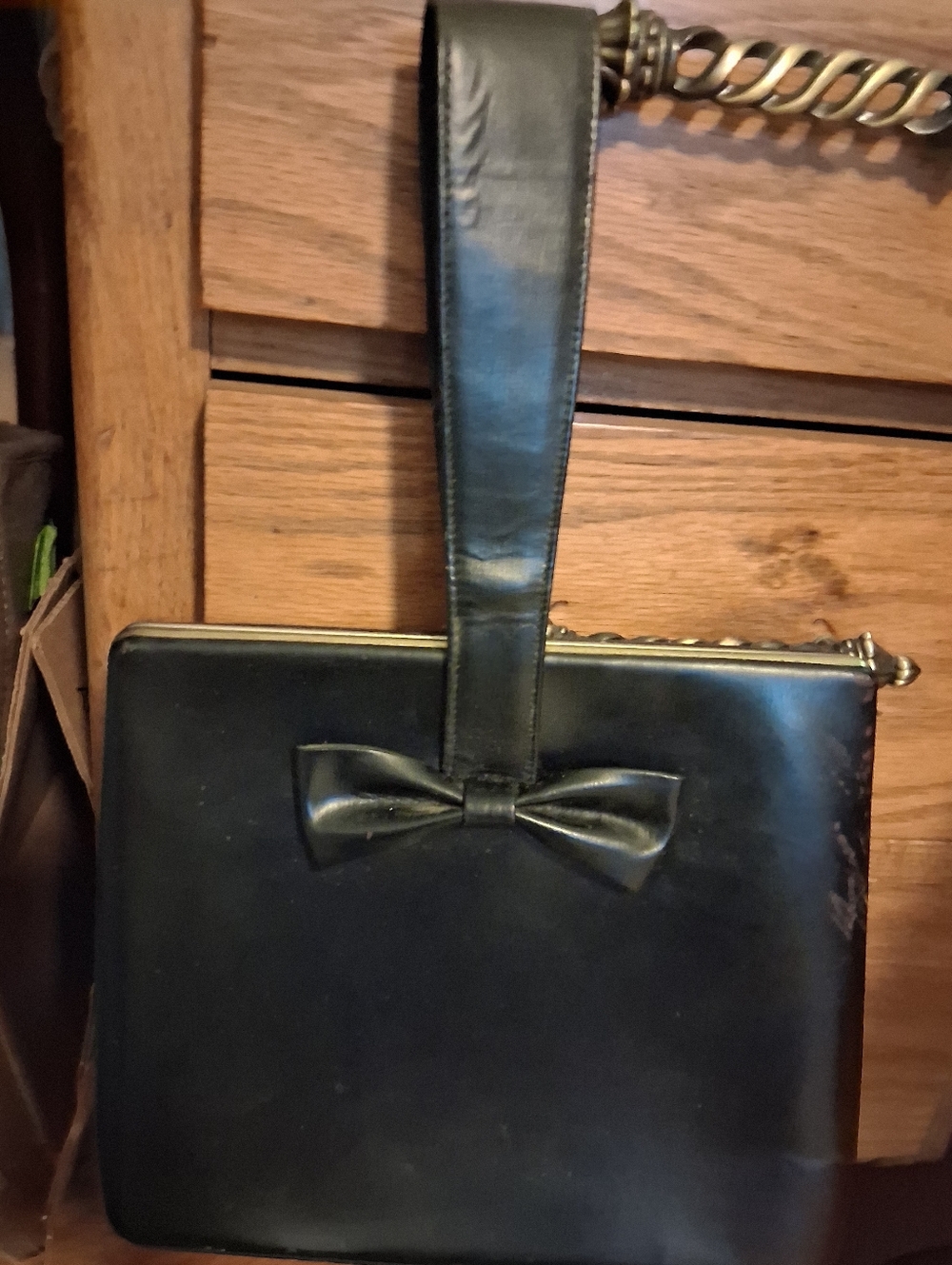 Vintage Black Structured Handbag with Top Handle and Bow